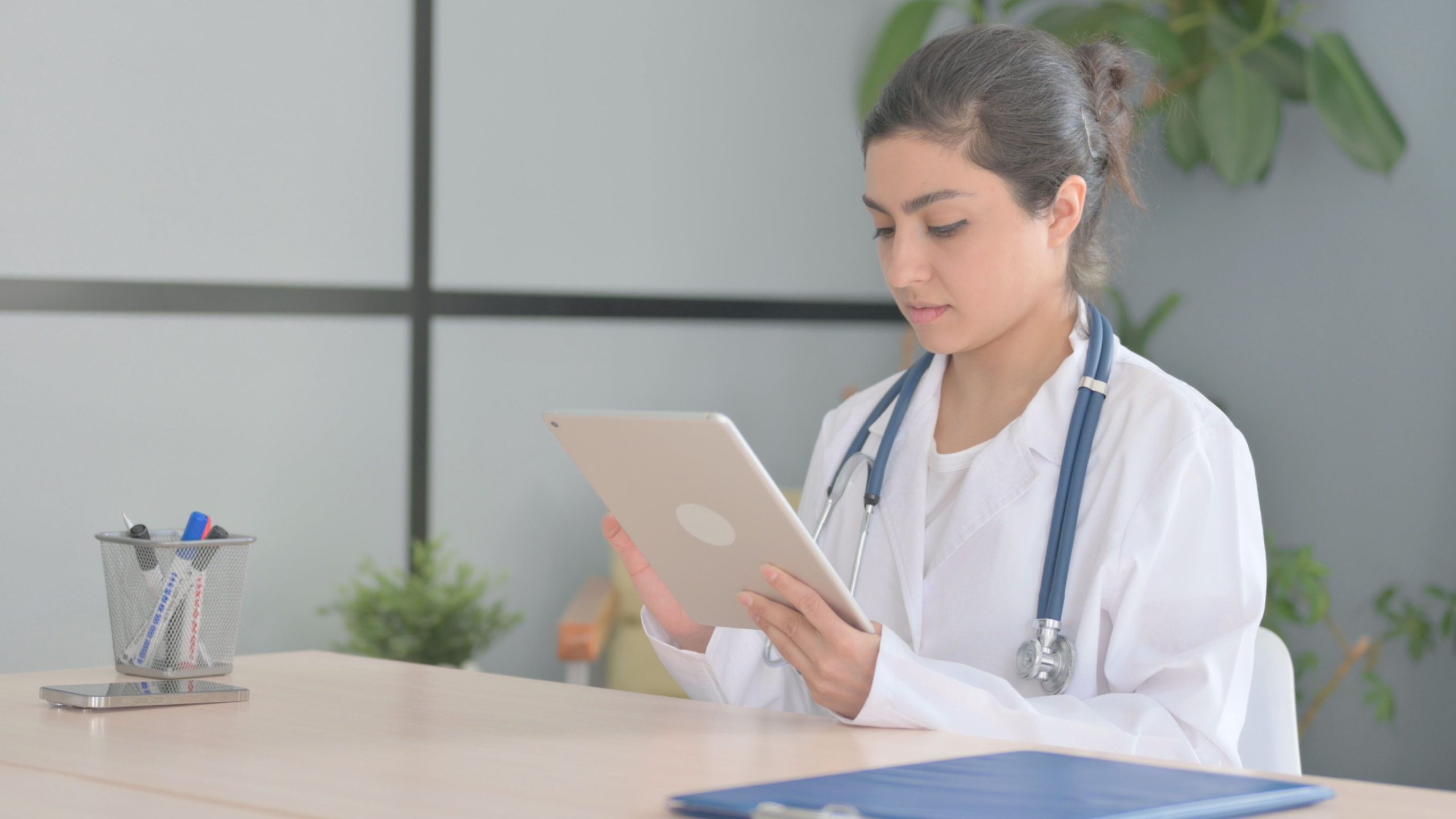 A prospective resident working on her ERAS application on her tablet.